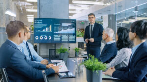 professional accountant gives a presentation in a conference room in front of colleagues