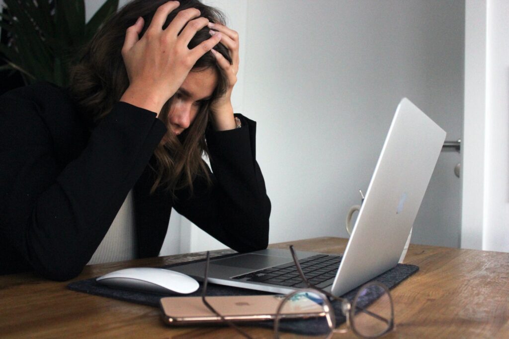 woman at laptop looking for a job after getting laid off